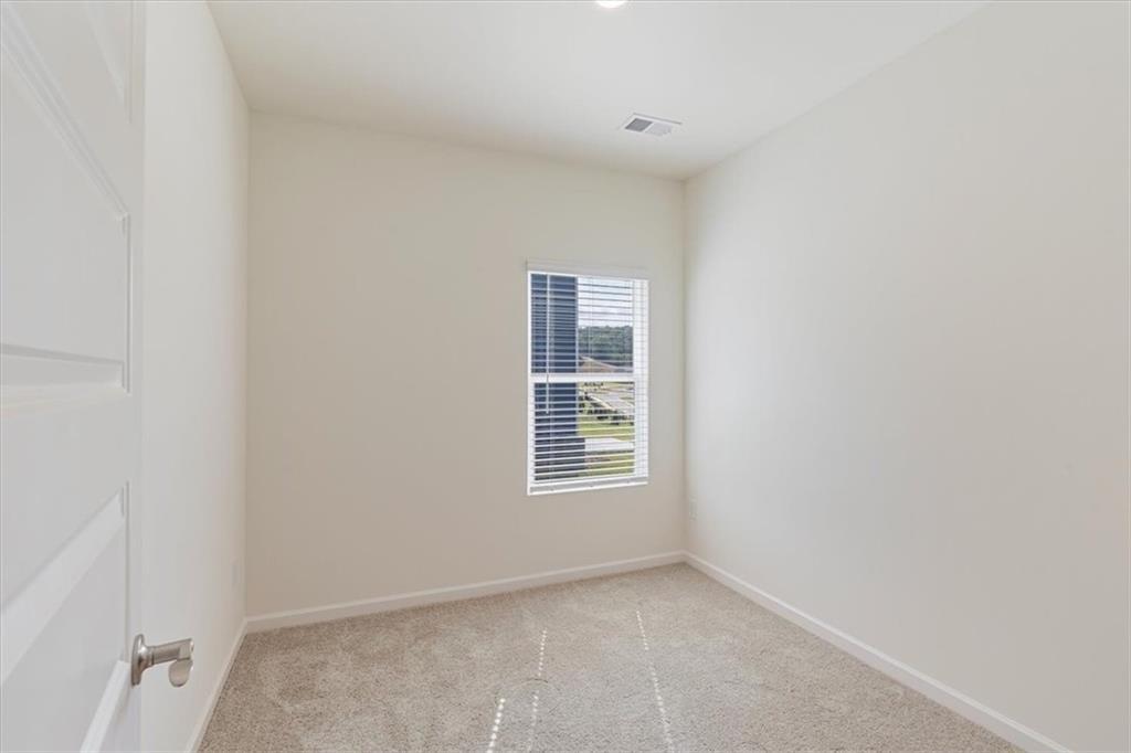 118 Lavender Circle Calhoun, GA 30701 - Photo 17 of 31 a view of an empty room with a window