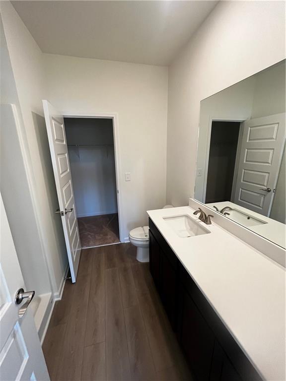 118 Lavender Circle Calhoun, GA 30701 - Photo 20 of 31 a bathroom with a sink a toilet a mirror and vanity