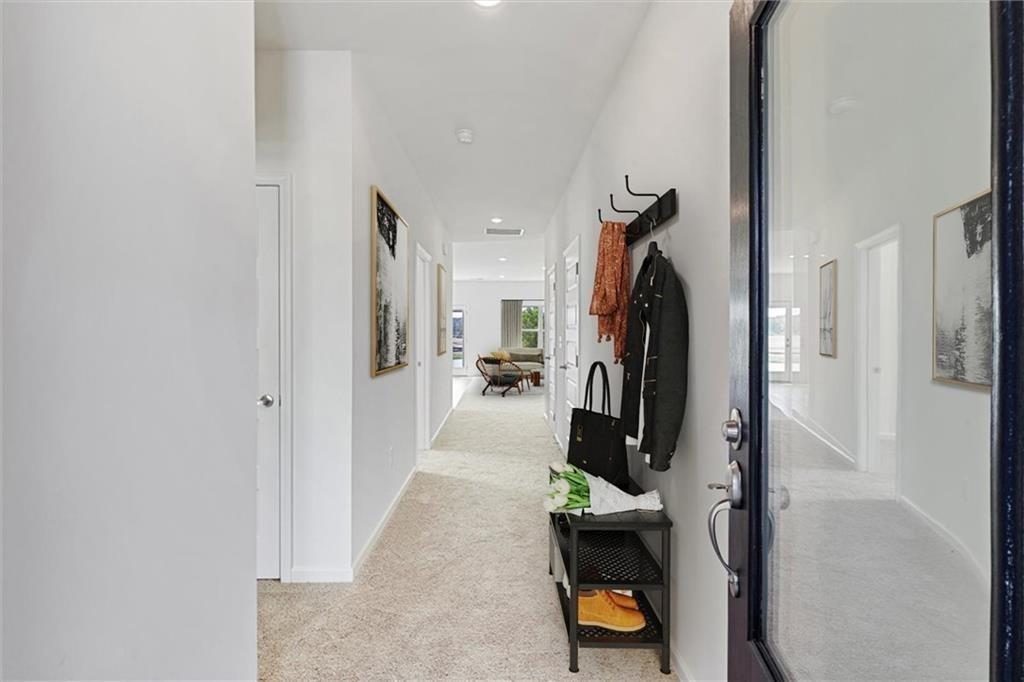 118 Lavender Circle Calhoun, GA 30701 - Photo 4 of 31 a view of a hallway view with living room and furniture