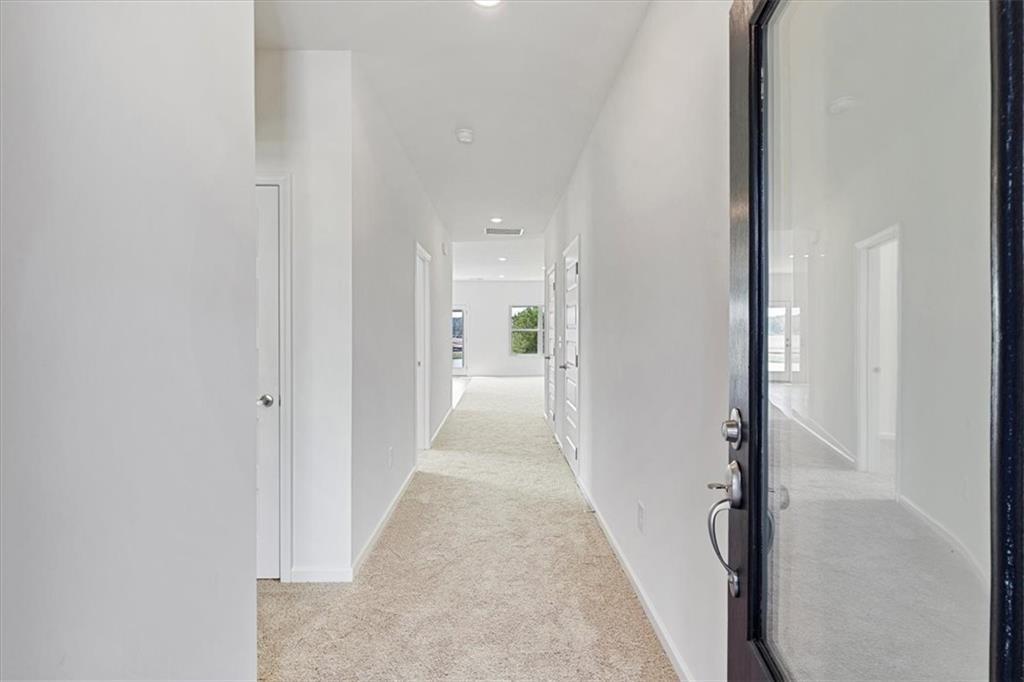 118 Lavender Circle Calhoun, GA 30701 - Photo 5 of 31 a view of a hallway with white walls and closet