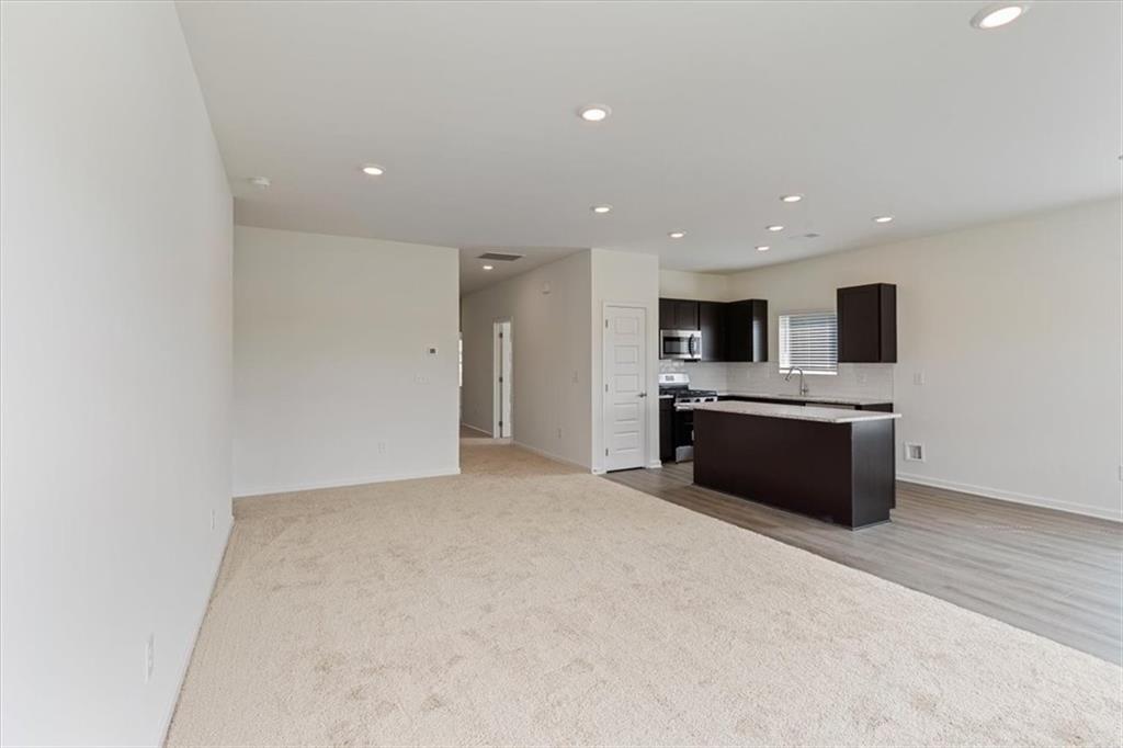 118 Lavender Circle Calhoun, GA 30701 - Photo 9 of 31 a large white kitchen with a sink stainless steel appliances and cabinets