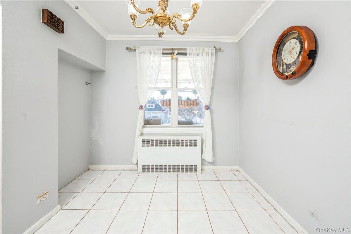 412 Calhoun Avenue Bronx, NY 10465 - Photo 9 of 26 a view of a room with wooden floor and windows