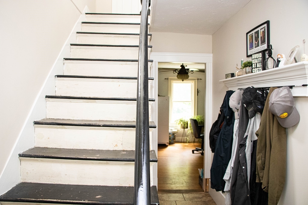 85-87 Slater Street Webster, MA 01570 - Photo 25 of 41 a view of walk in closet with clothes and shoes