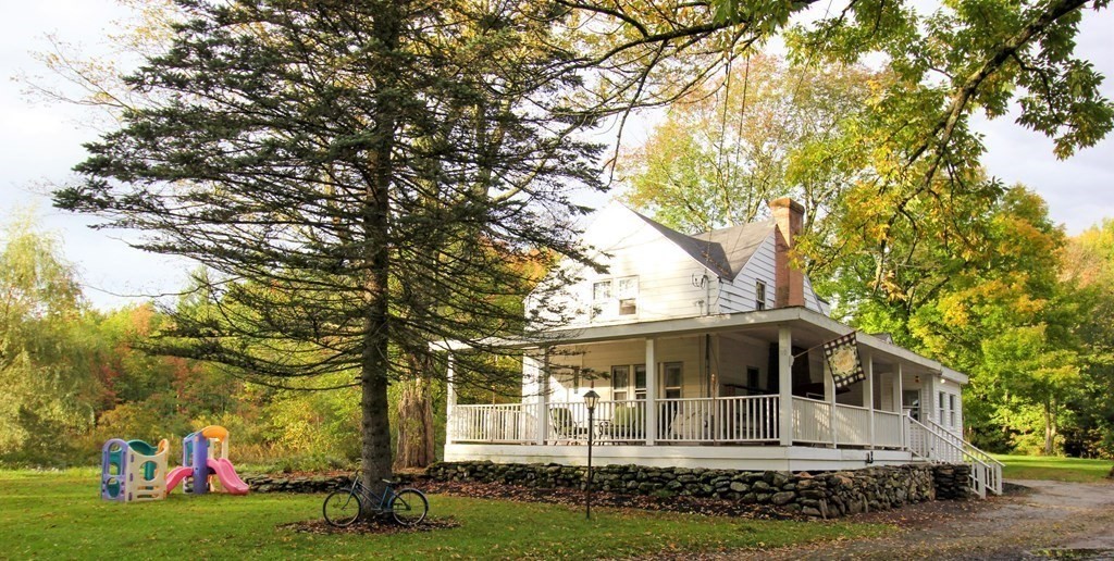 28 Flagg Road Hubbardston, MA 01452 - Photo 1 of 40 a front view of a house with a garden