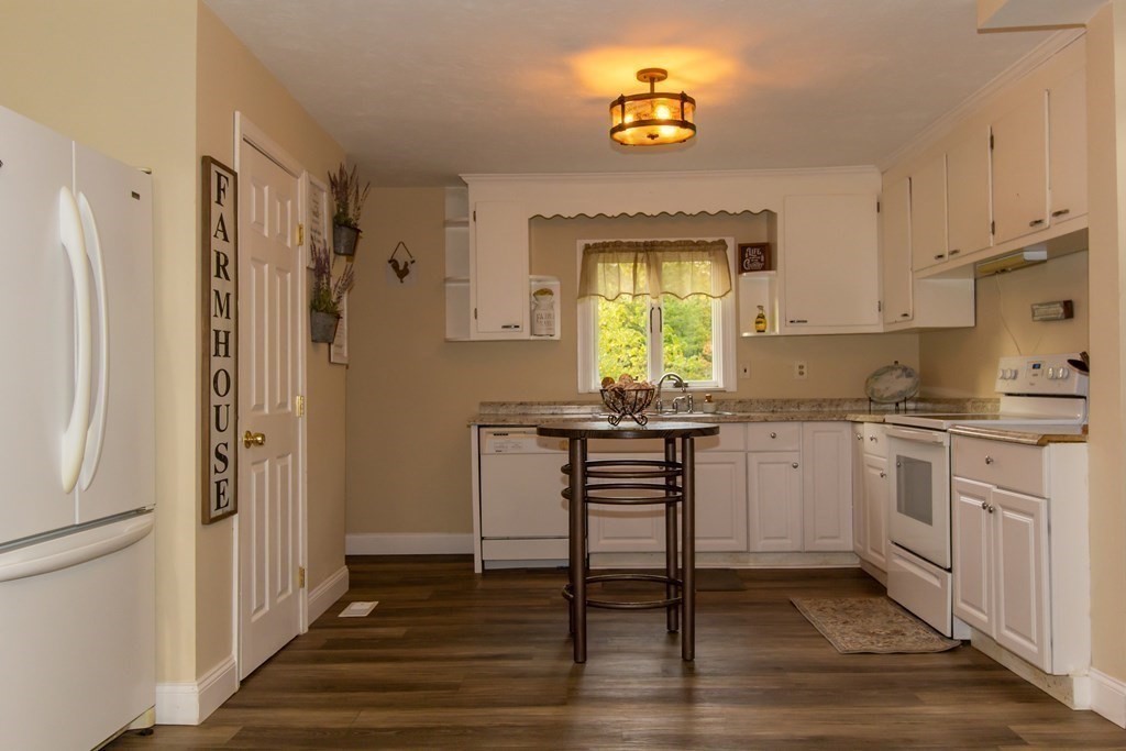 28 Flagg Road Hubbardston, MA 01452 - Photo 13 of 40 a kitchen with stainless steel appliances granite countertop a refrigerator and a stove top oven