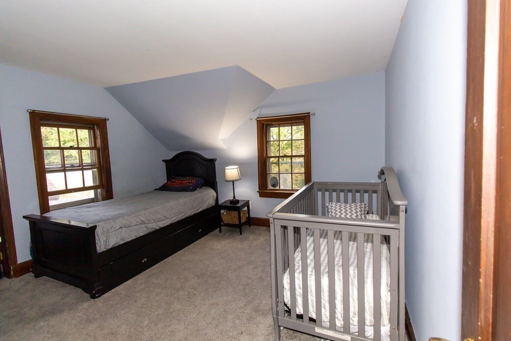 28 Flagg Road Hubbardston, MA 01452 - Photo 22 of 40 a bedroom with a bed and a window