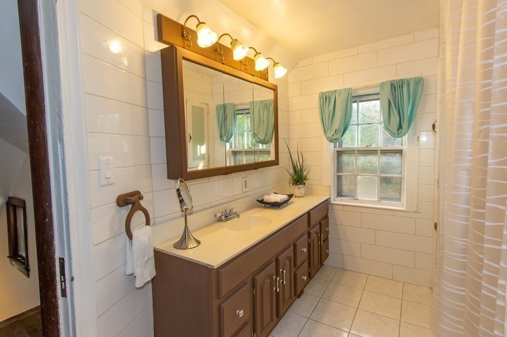 28 Flagg Road Hubbardston, MA 01452 - Photo 28 of 40 a bathroom with a sink and a mirror