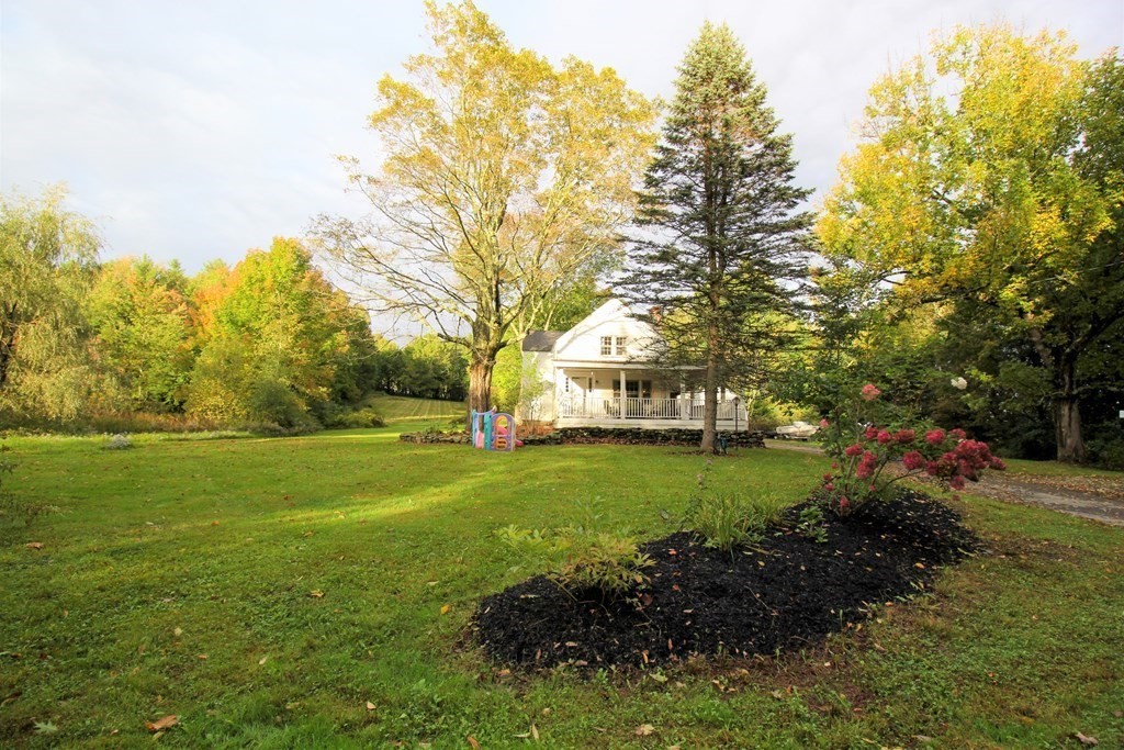 28 Flagg Road Hubbardston, MA 01452 - Photo 3 of 40 a view of a garden with large trees