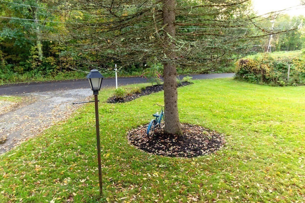 28 Flagg Road Hubbardston, MA 01452 - Photo 33 of 40 a view of a garden with a fountain