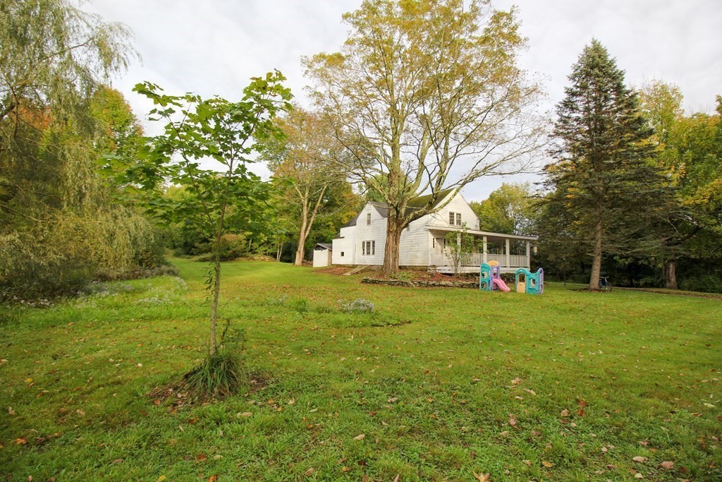 28 Flagg Road Hubbardston, MA 01452 - Photo 40 of 40 a view of a house with a yard and trees