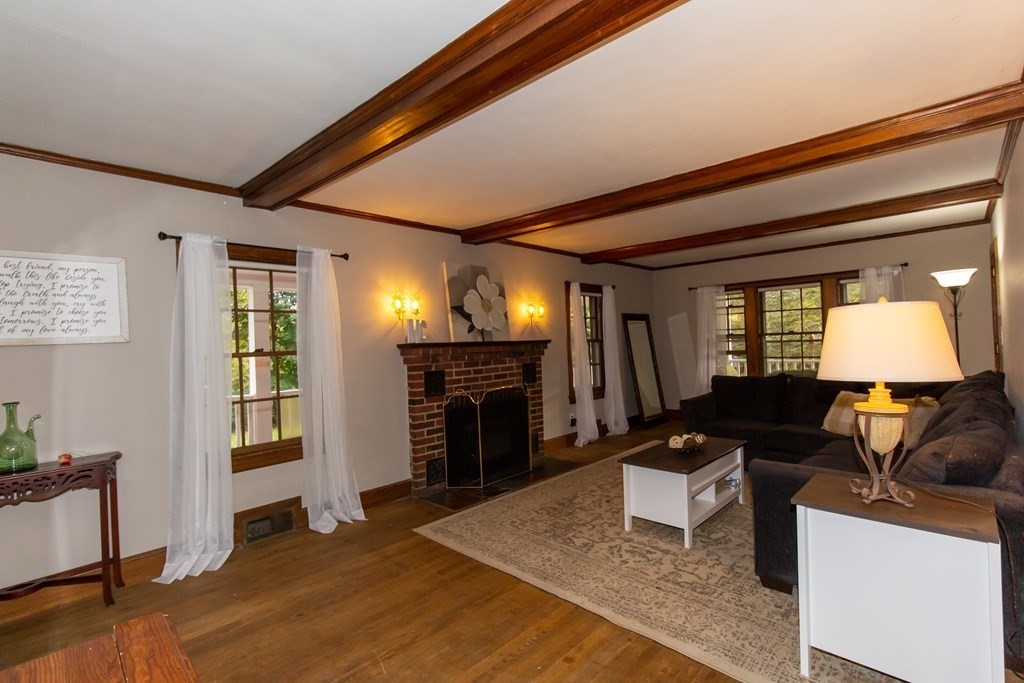 28 Flagg Road Hubbardston, MA 01452 - Photo 6 of 40 a living room with furniture and a fireplace