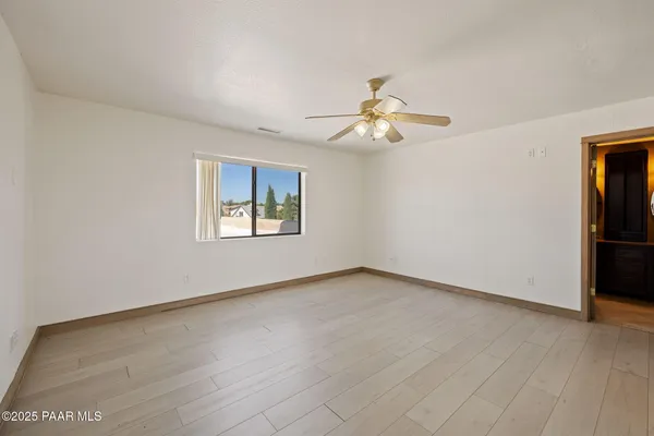 a view of bathroom with bathtub and window