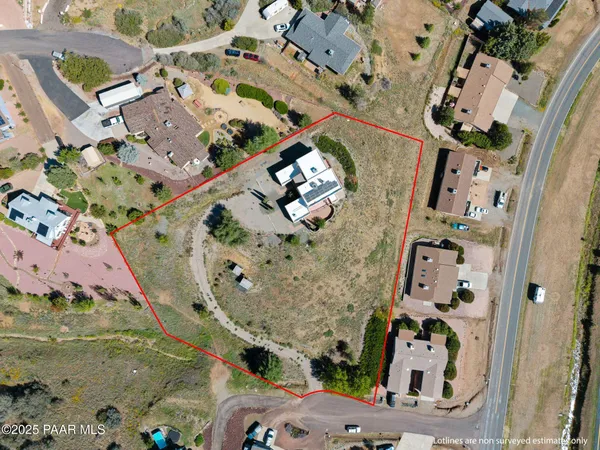 an aerial view of a house with a swimming pool