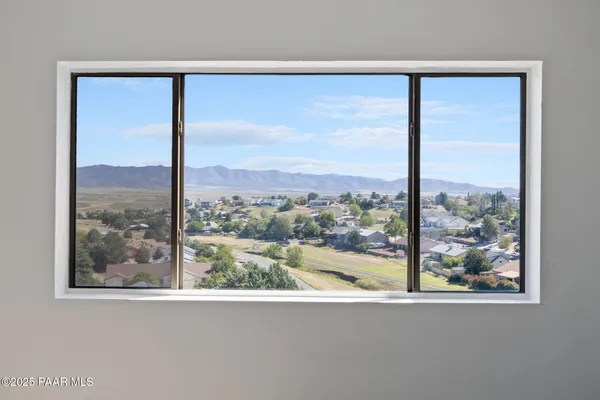 a view of city and mountain from a balcony