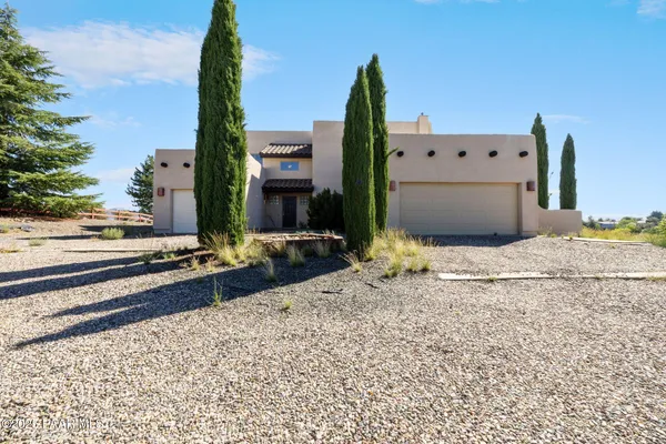 a view of a backyard of the house