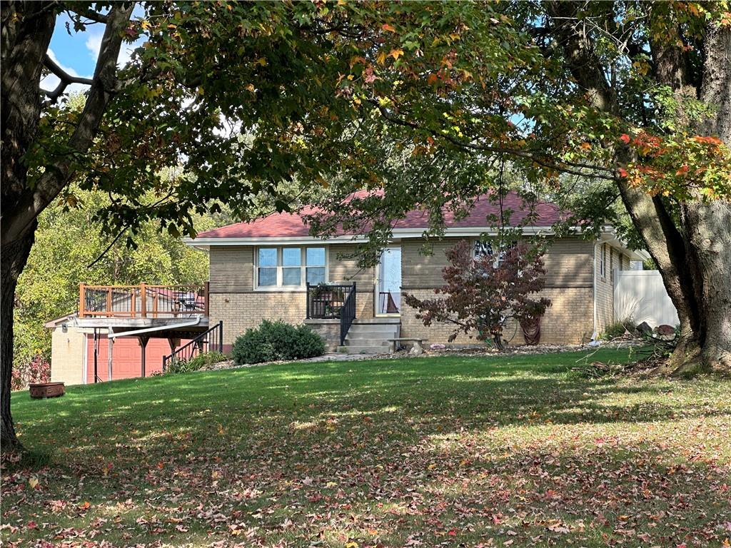 401 Clements Road Pittsburgh, PA 15239 - Photo 3 of 24 a front view of a house with a garden and trees