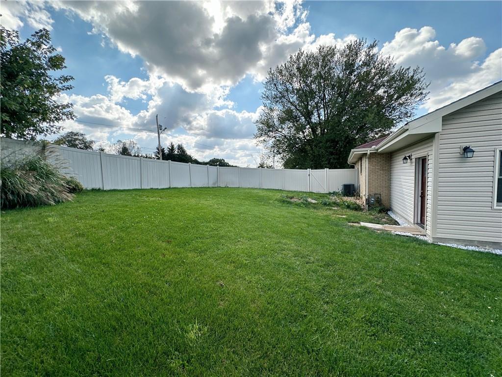 401 Clements Road Pittsburgh, PA 15239 - Photo 7 of 24 a view of a backyard with potted plants and large trees