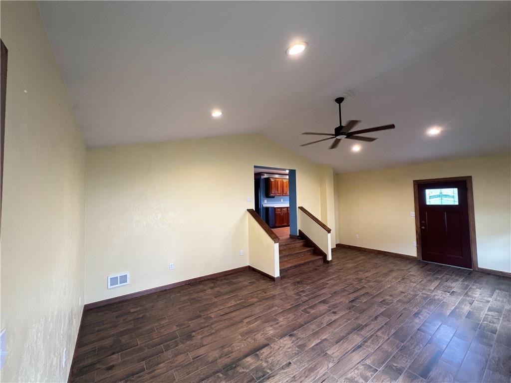 401 Clements Road Pittsburgh, PA 15239 - Photo 9 of 24 a view of an empty room with wooden floor and a ceiling fan