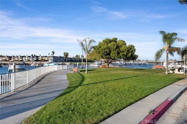 a view of a swimming pool with a lawn chairs