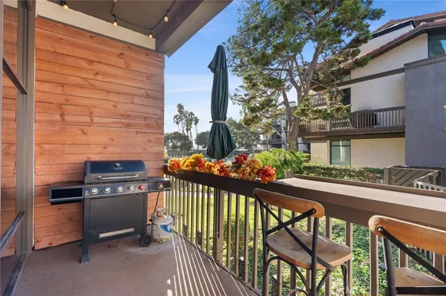 a front view of a house with outdoor seating