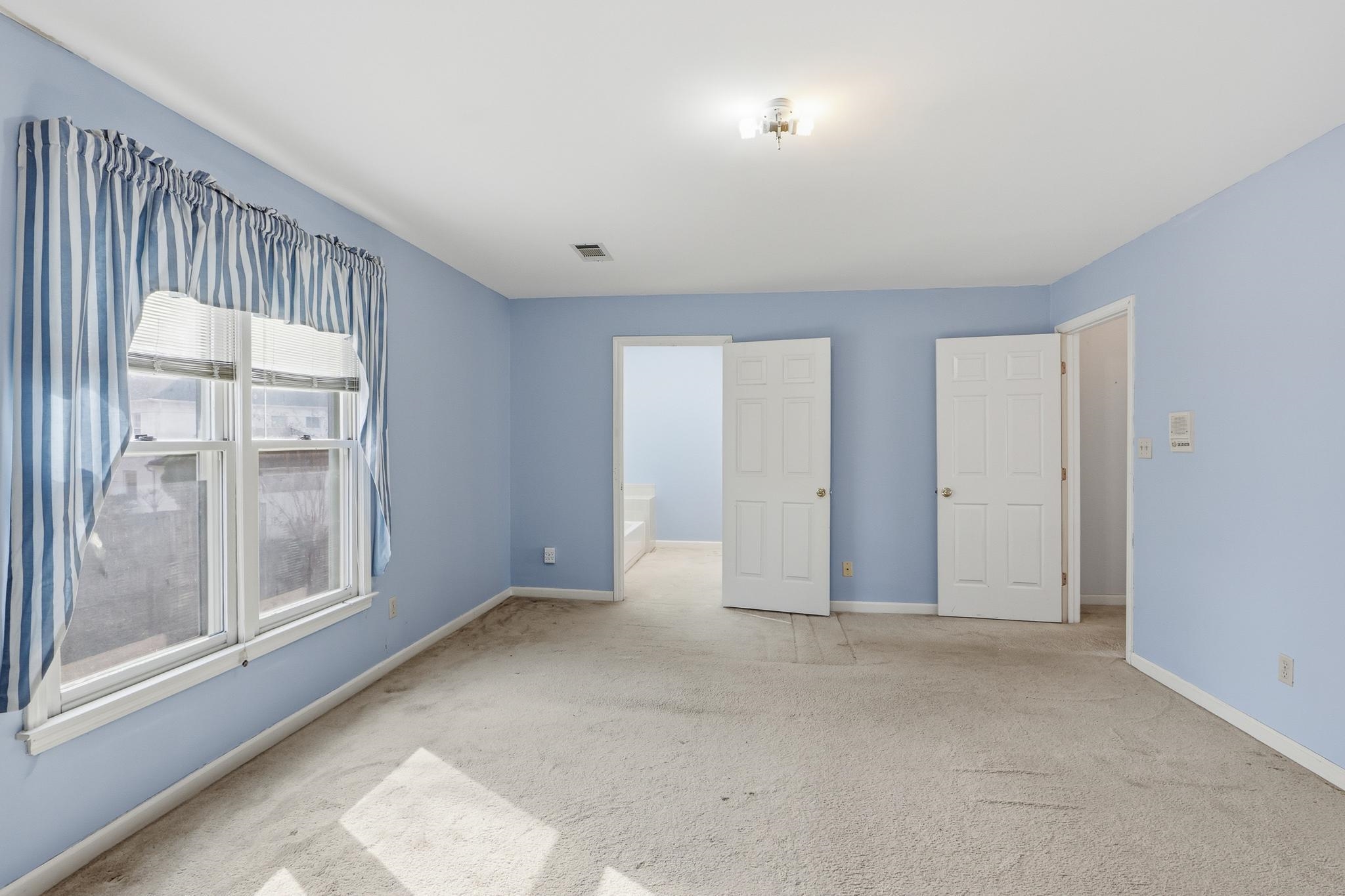 2670 Stout Rd Cove Memphis, TN 38119 - Photo 25 of 37 an empty room with windows