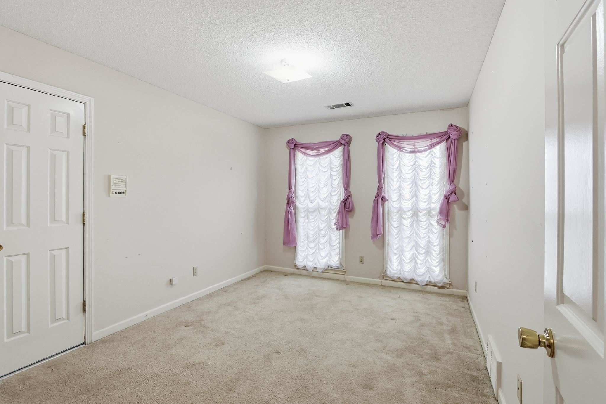 2670 Stout Rd Cove Memphis, TN 38119 - Photo 28 of 37 Spare room with a textured ceiling and carpet