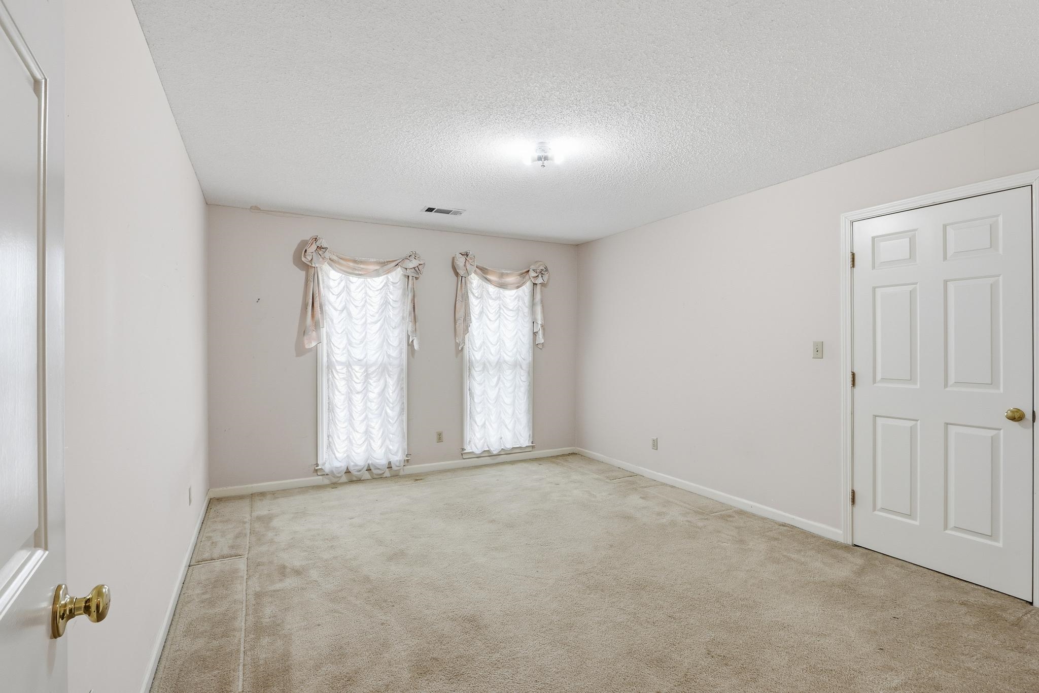 2670 Stout Rd Cove Memphis, TN 38119 - Photo 30 of 37 Unfurnished room featuring a textured ceiling and light carpet