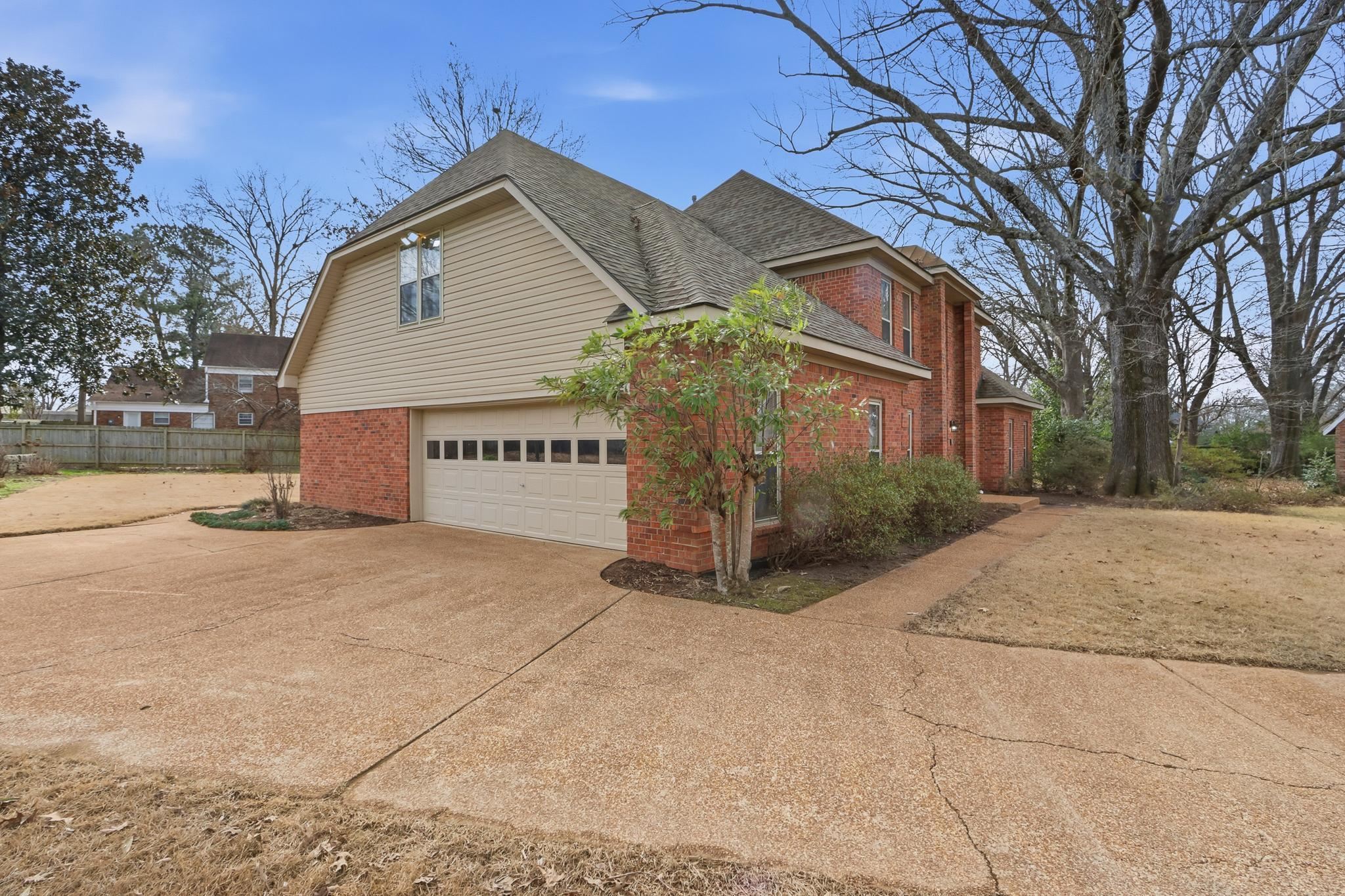 2670 Stout Rd Cove Memphis, TN 38119 - Photo 4 of 37 a view of a house with a yard and garage