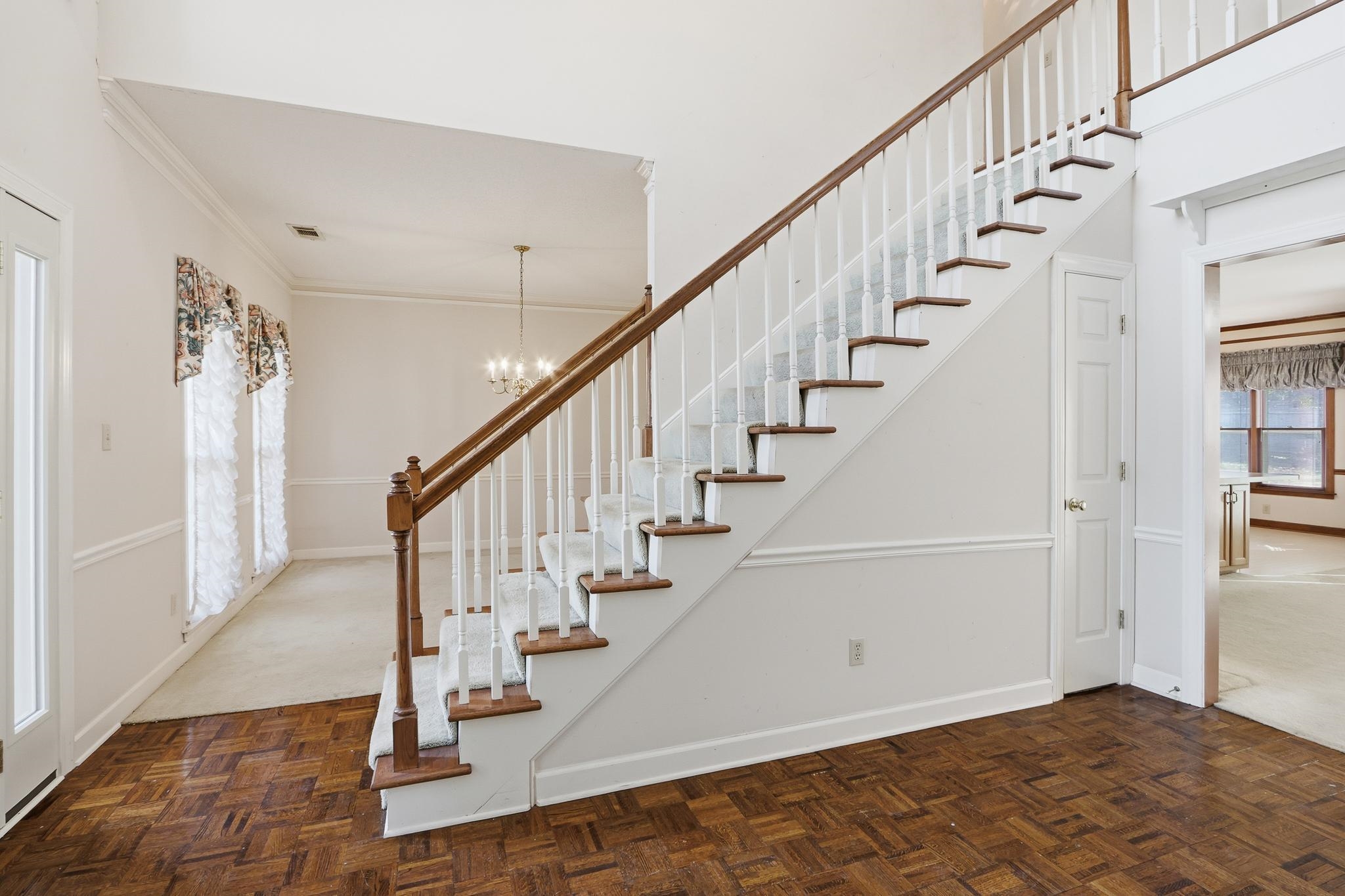 2670 Stout Rd Cove Memphis, TN 38119 - Photo 7 of 37 a view of staircase with wooden floor and a rug