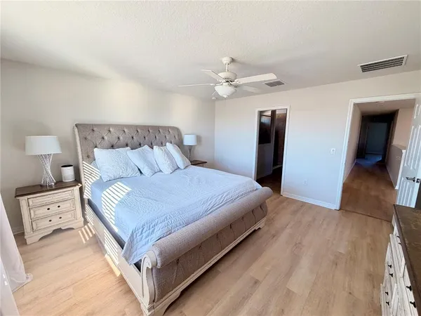 a bedroom with a bed and a tv