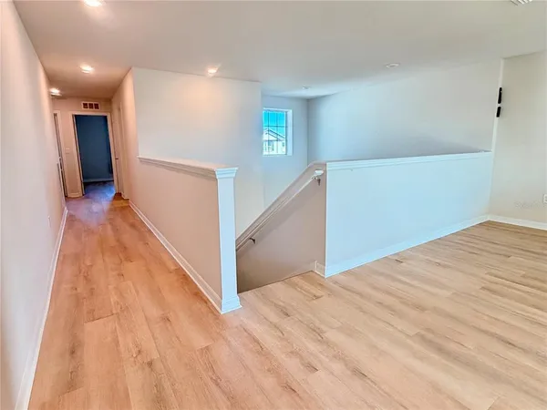 a view of hallway with stairs