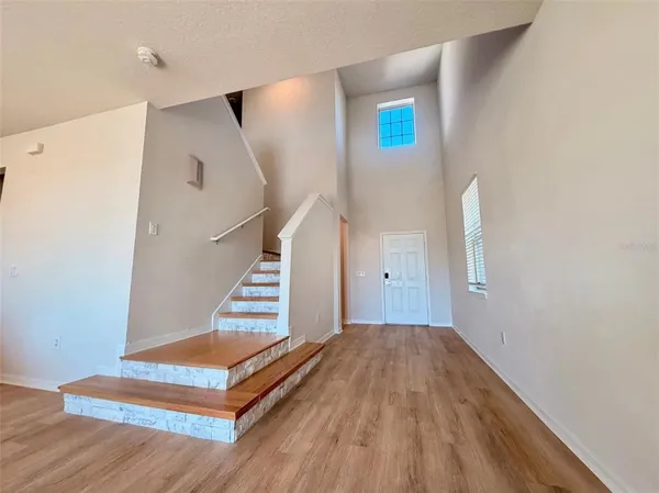 a view of a hallway with staircase