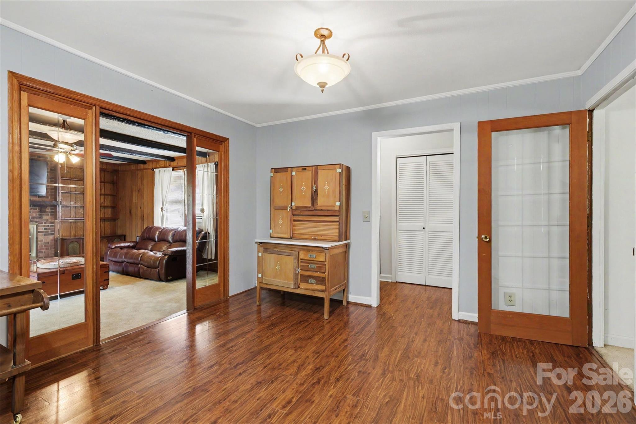 6774 Woodhaven Road Kershaw, SC 29067 - Photo 6 of 30 a view of a livingroom with hardwood floor and a ceiling fan