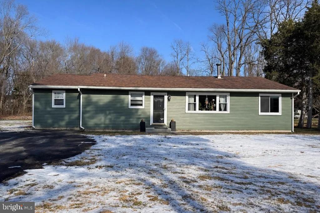 1919 Creek Road Hainesport, NJ 08036 - Photo 1 of 13 Charming green home nestled in winter's embrace.