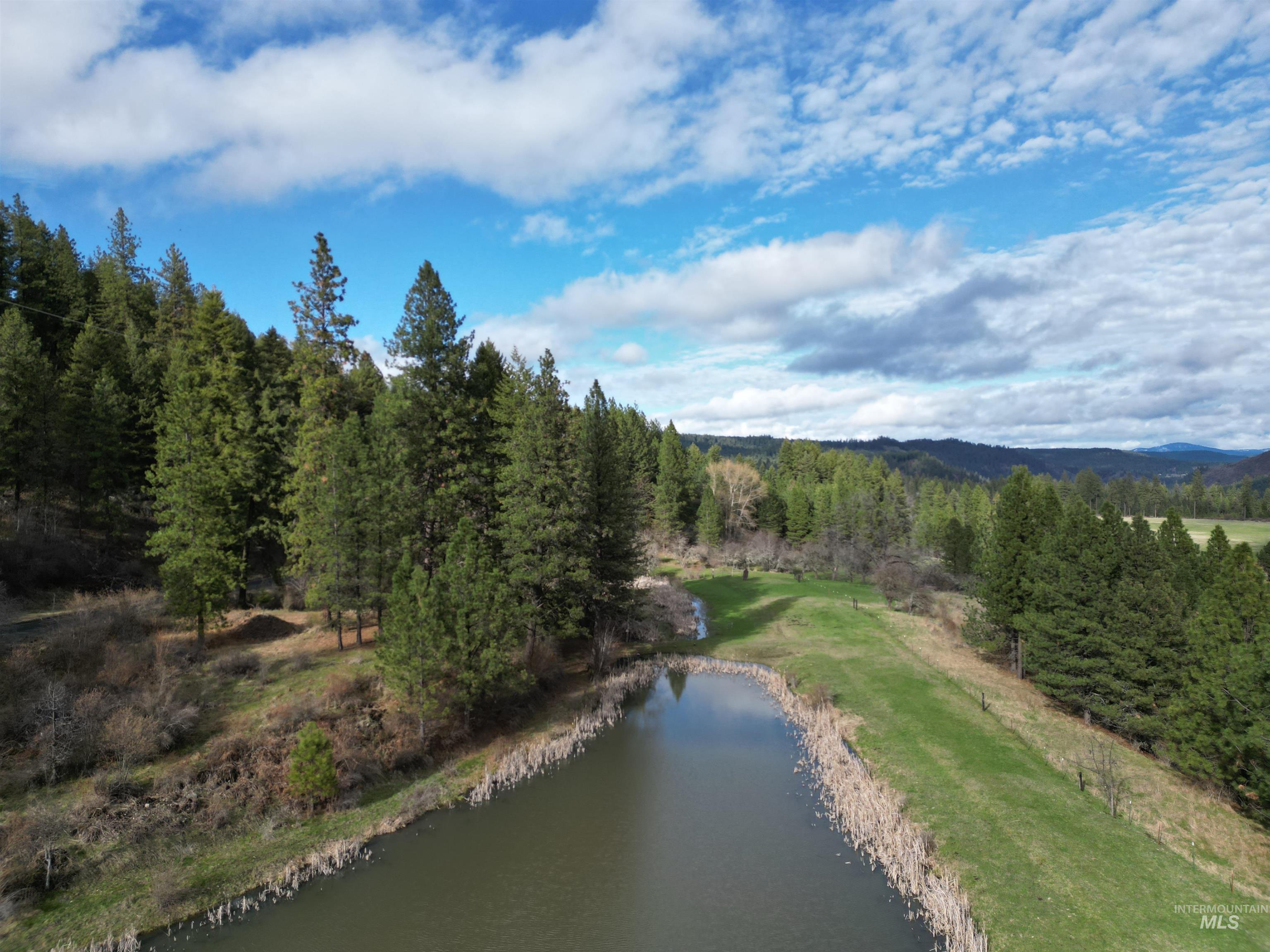 Tbd Harmony Hts Loop Orofino, ID 83544 - Photo 10 of 16 Aerial view of a heavily wooded area and a nearby body of water