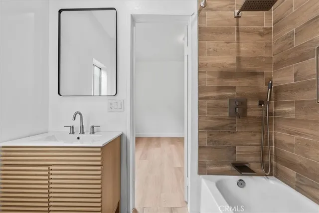 a bathroom with a bathtub and a sink