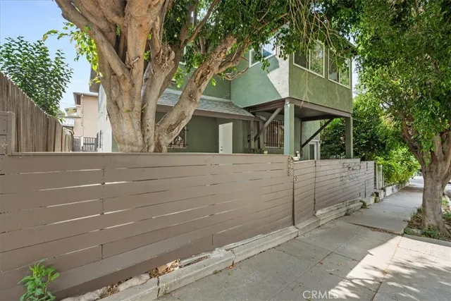 a view of a house with a tree