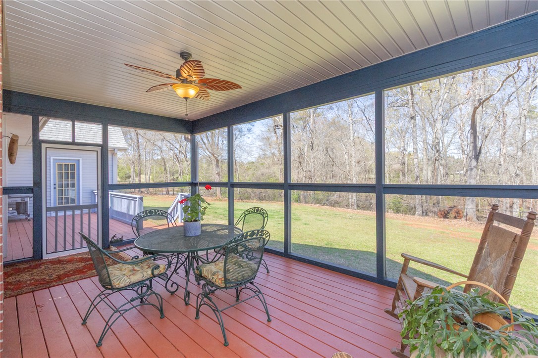 108 Pearman Drive Pendleton, SC 29670 - Photo 44 of 50 This inviting screened porch offers serene views, perfect for peaceful outdoor enjoyment.