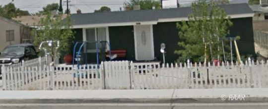 425 North Norma Street Ridgecrest, CA 93555 - Photo 1 of 33 a view of a house with a small yard and plants