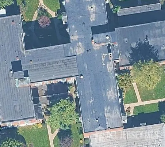 a aerial view of a house with a yard