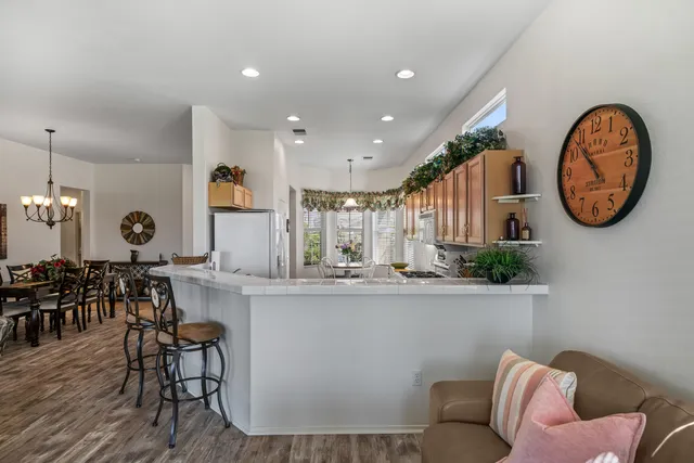 a view of kitchen with stainless steel appliances granite countertop lots of counter top space