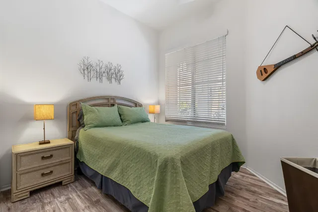 a bedroom with a bed and a dresser