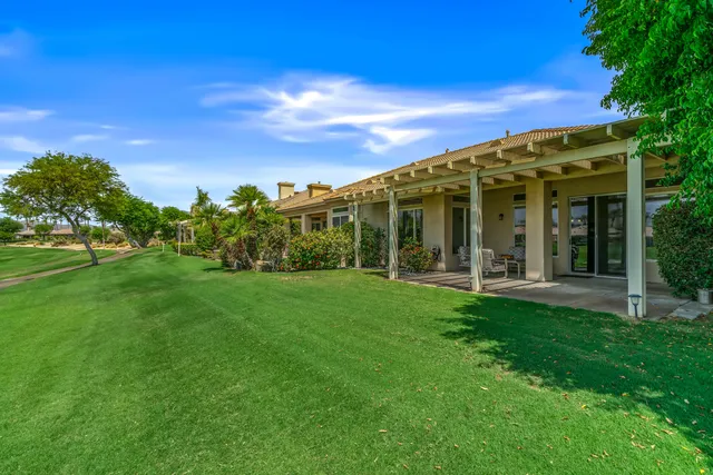 front view of a house with a garden