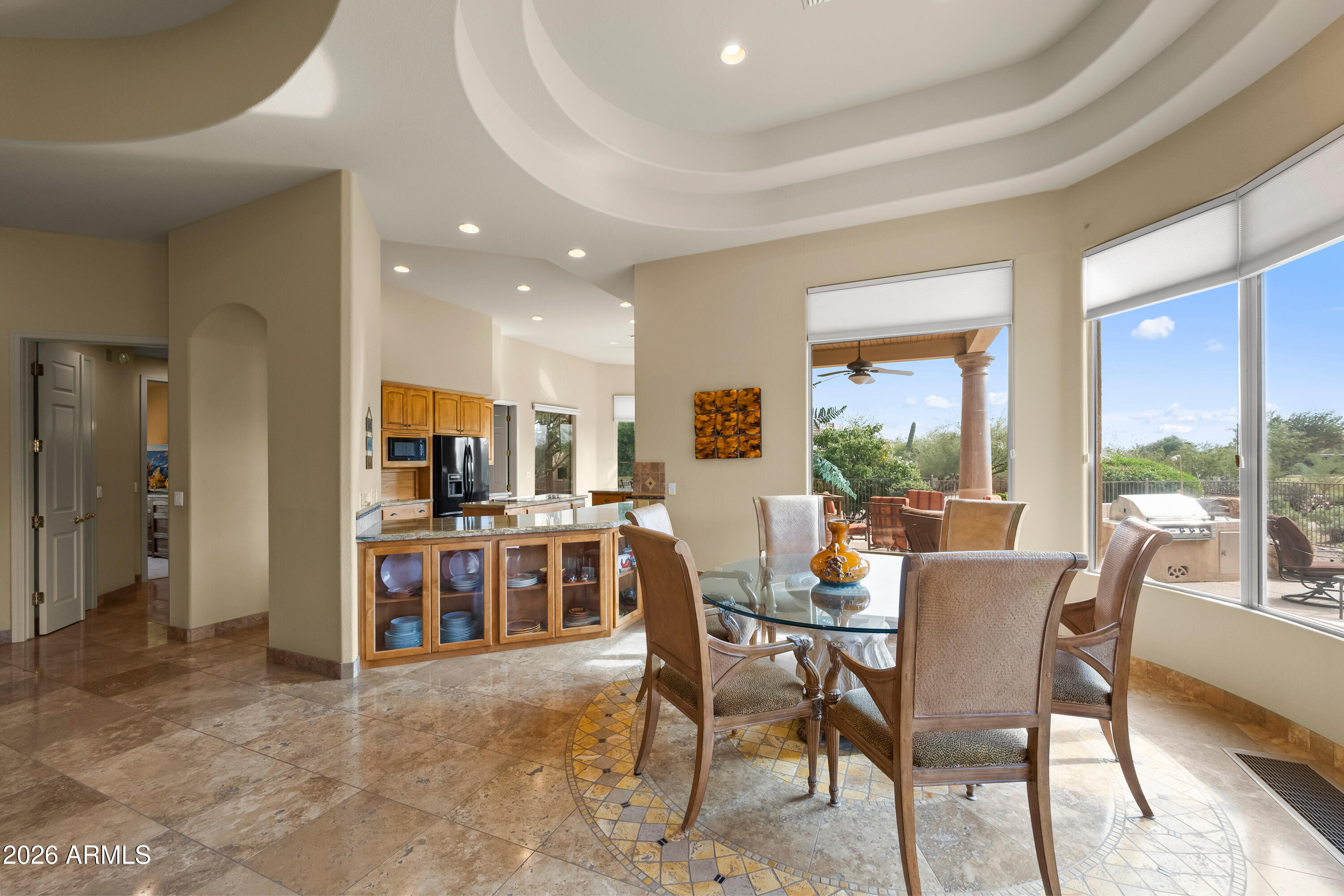 18513 East Agua Verde Drive Rio Verde, AZ 85263 - Photo 13 of 42 a view of a dining room with furniture window and outside view