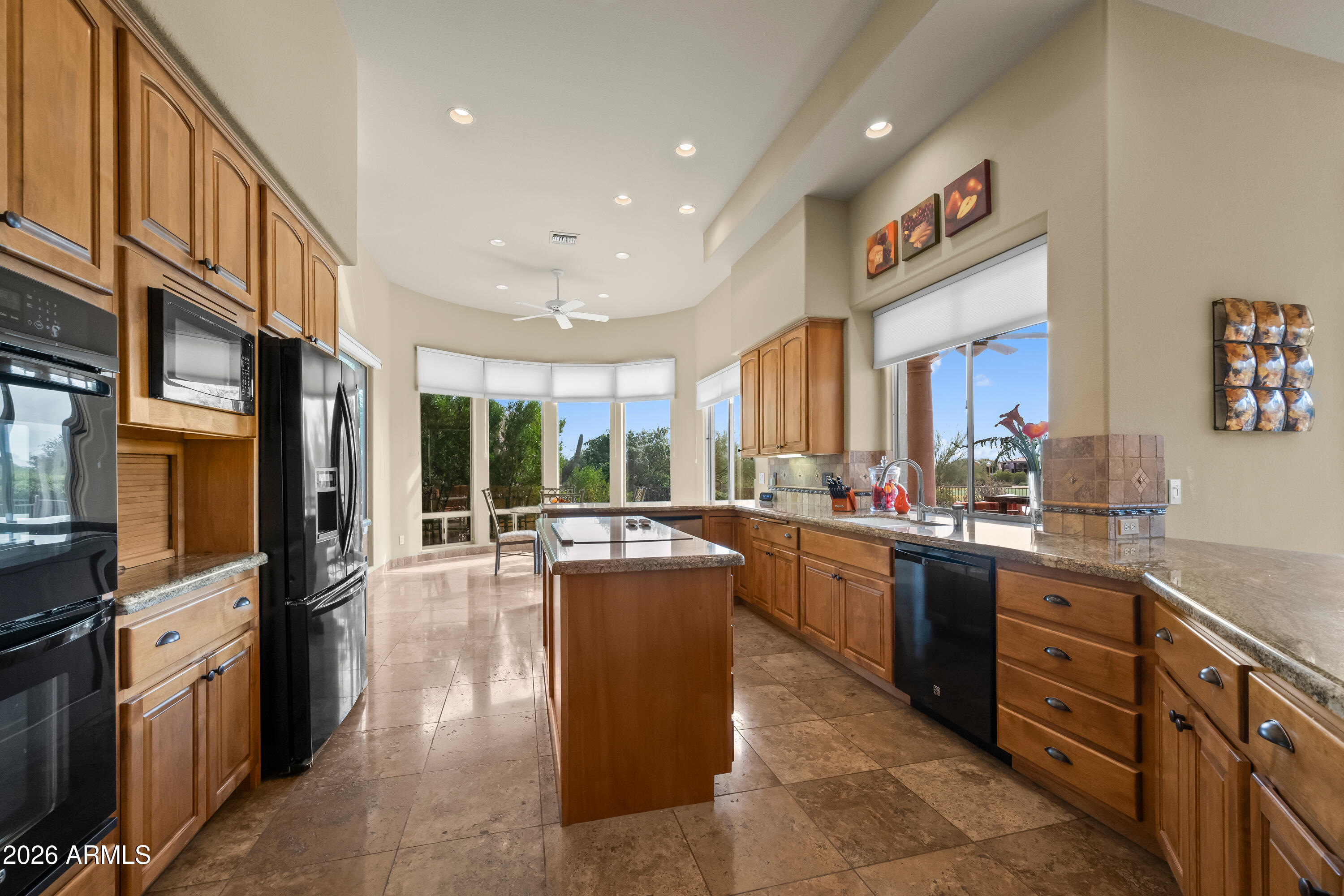 18513 East Agua Verde Drive Rio Verde, AZ 85263 - Photo 15 of 42 a large kitchen with stainless steel appliances lots of counter space and breakfast area