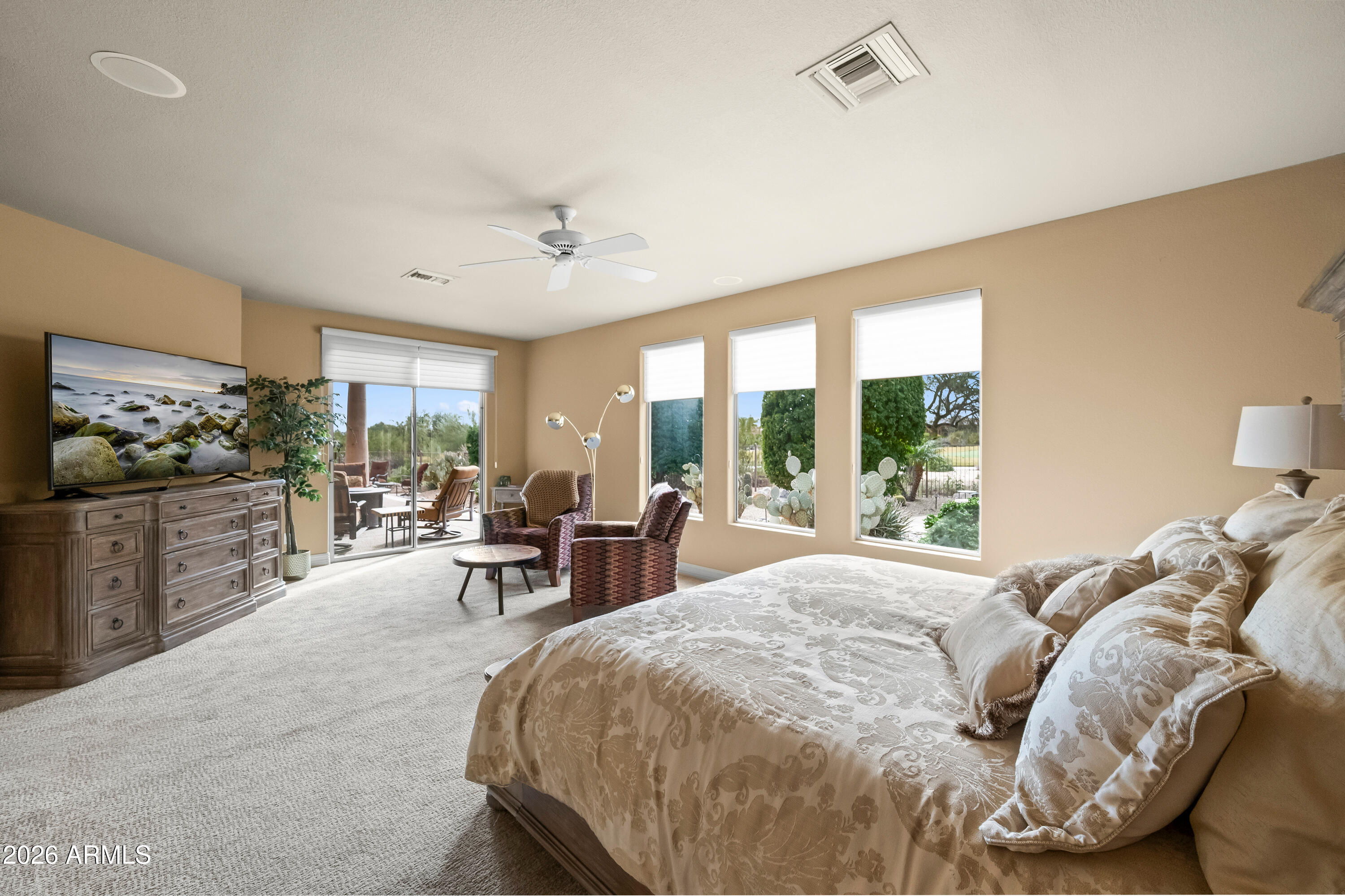 18513 East Agua Verde Drive Rio Verde, AZ 85263 - Photo 21 of 42 a bed room with a bed and a chair