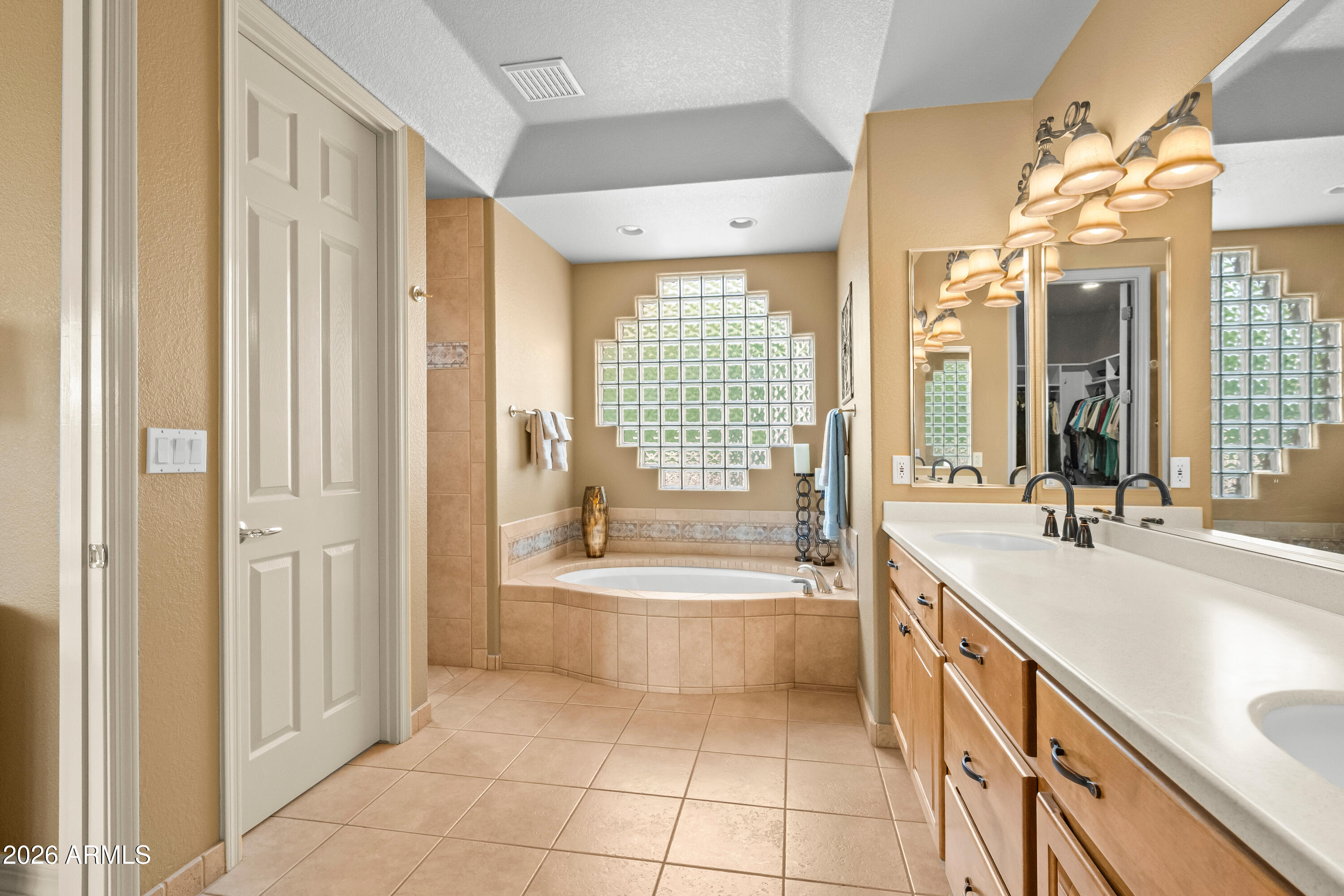 18513 East Agua Verde Drive Rio Verde, AZ 85263 - Photo 23 of 42 a spacious bathroom with a tub sink and mirror