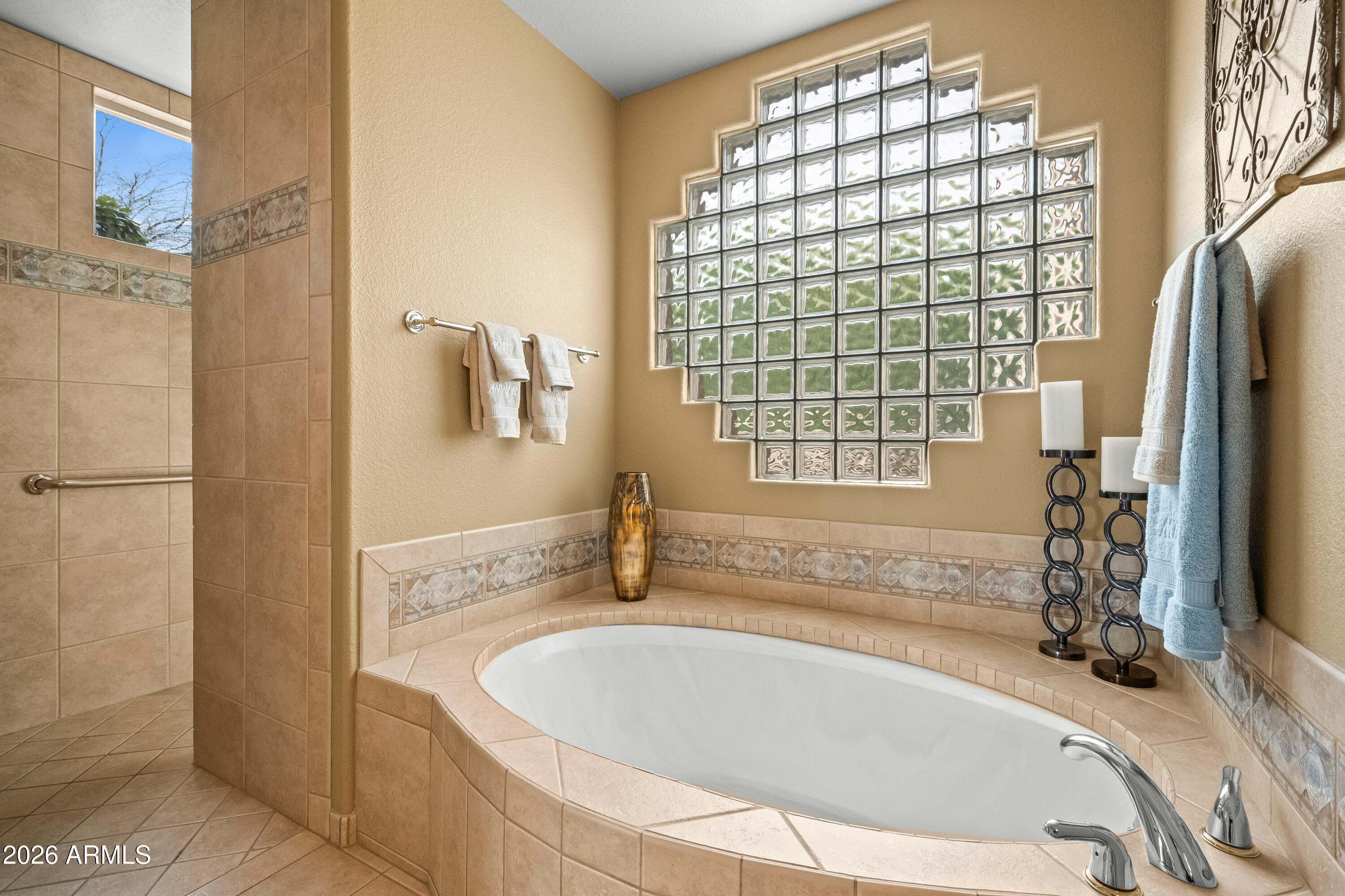 18513 East Agua Verde Drive Rio Verde, AZ 85263 - Photo 24 of 42 a bathroom with a tub and a shower