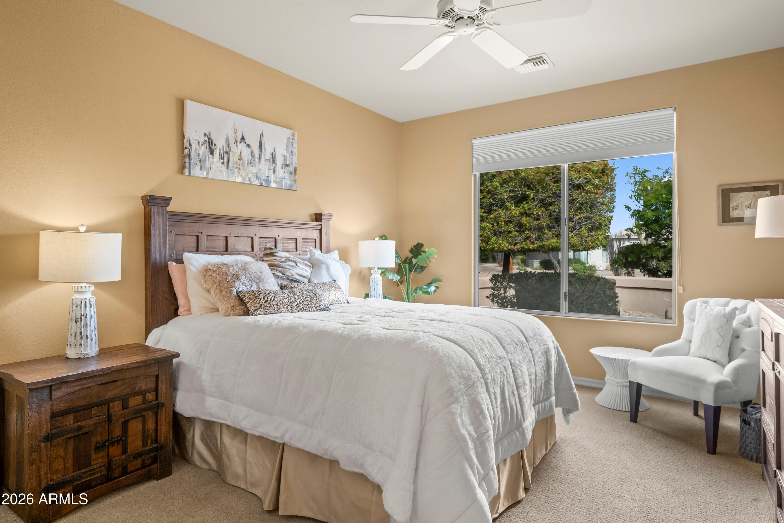 18513 East Agua Verde Drive Rio Verde, AZ 85263 - Photo 27 of 42 a bedroom with a bed a couch and a window