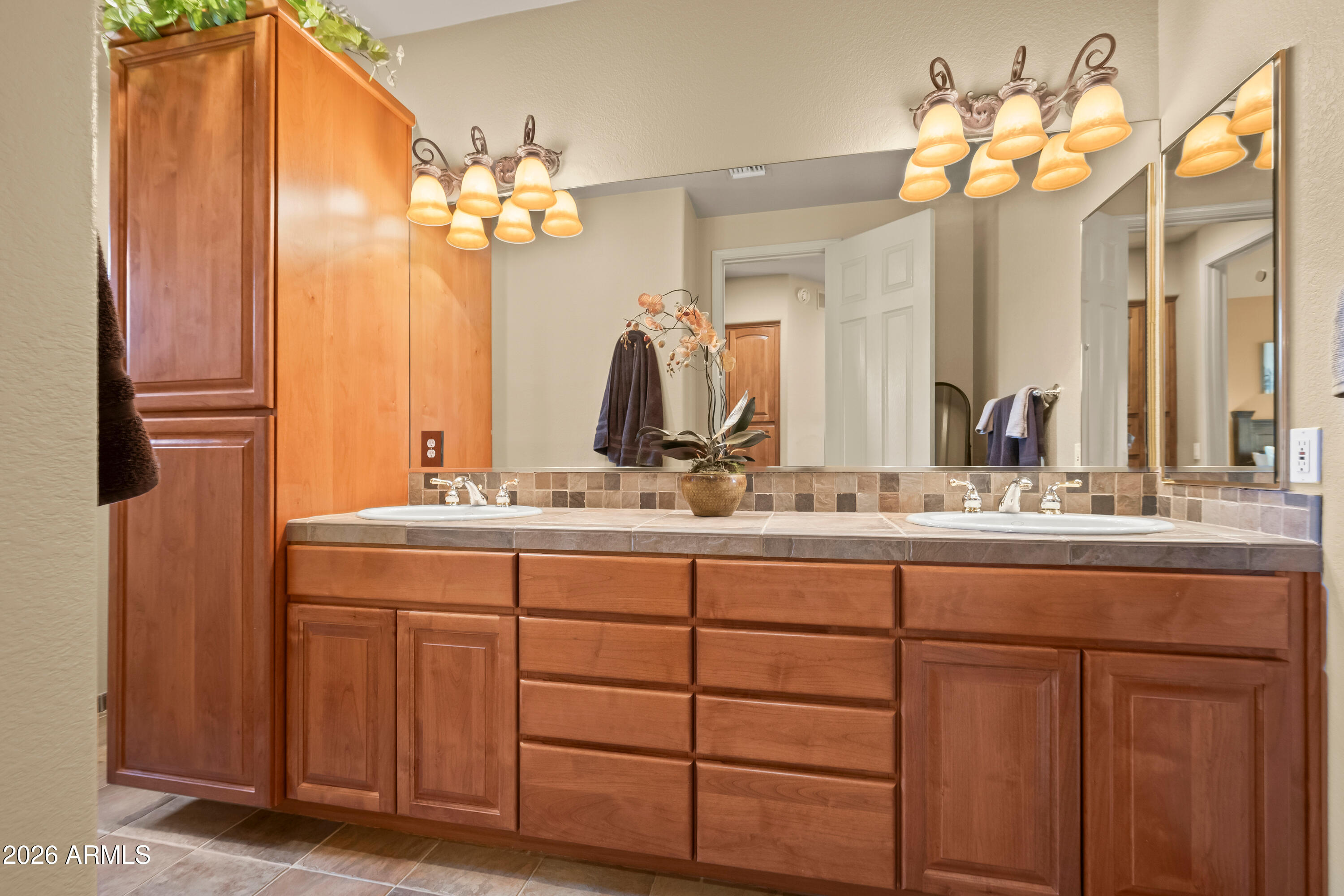18513 East Agua Verde Drive Rio Verde, AZ 85263 - Photo 28 of 42 a bathroom with a double vanity sink and a mirror